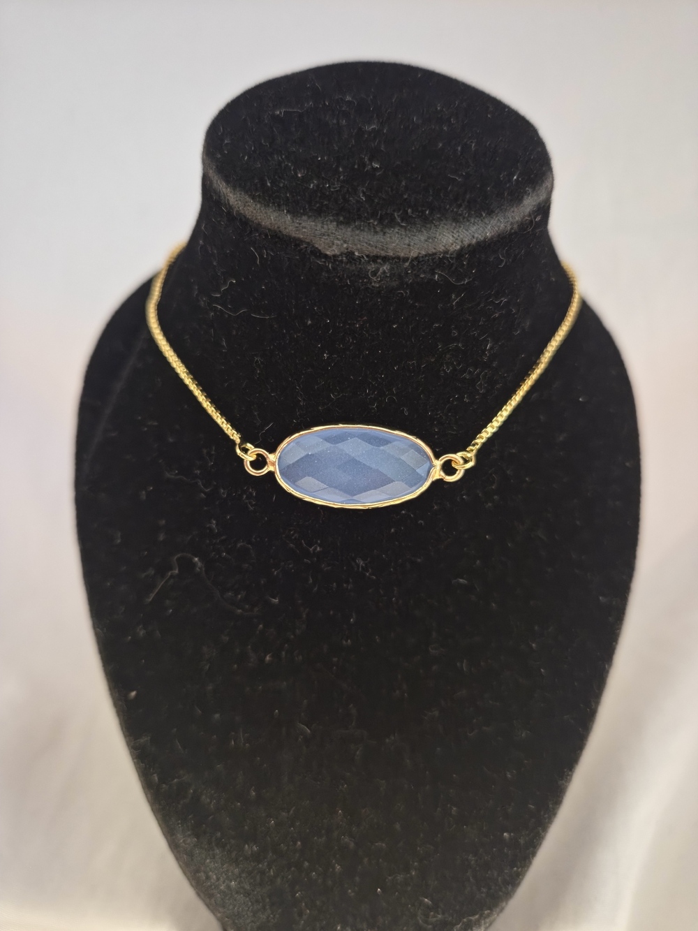 Gold  Adjustable Chain Bracelet with Blue Oval Faceted Stone